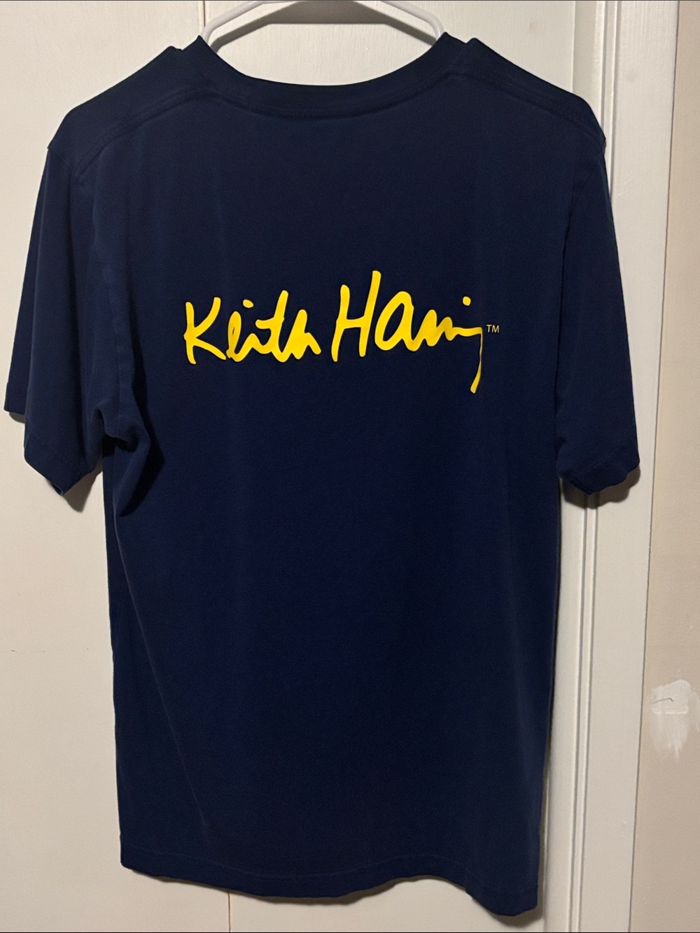 UNIQLO UT Keith Haring Navy Short Sleeve Tee w Yellow Script Logo